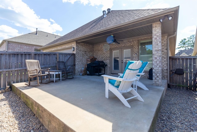 view of patio / terrace featuring area for grilling, ceiling fan, and french doors