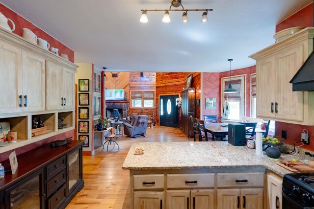 6 Aviation Way, Heber Springs, AR 72543 - kitchen featuring wooden walls, open floor plan, a peninsula, light wood-style floors, and light brown cabinetry