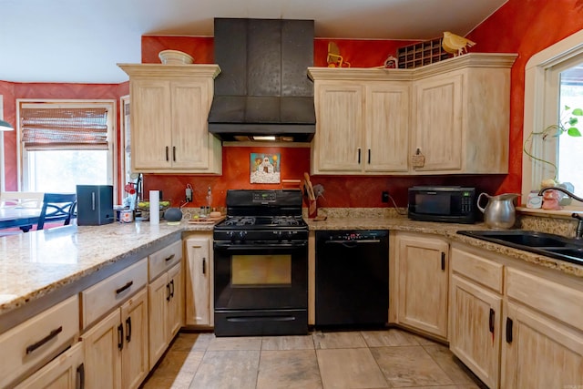 kitchen featuring sink, black appliances, light stone countertops, light brown cabinetry, and premium range hood