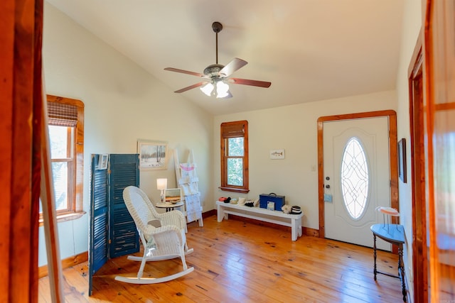 entryway featuring hardwood / wood-style flooring, lofted ceiling, ceiling fan, and plenty of natural light