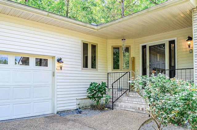 view of exterior entry featuring a garage