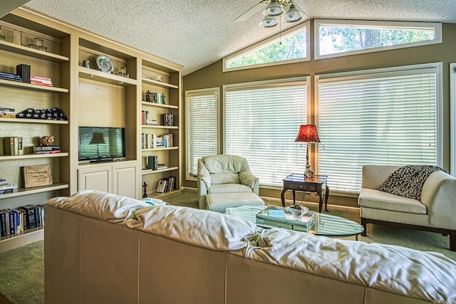 living room featuring ceiling fan, a textured ceiling, lofted ceiling, and built in features