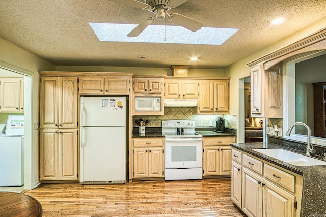 kitchen featuring ceiling fan, light wood-type flooring, sink, and white appliances