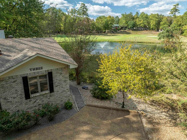 view of home's exterior with a water view