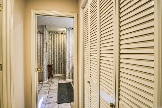 corridor with a textured ceiling