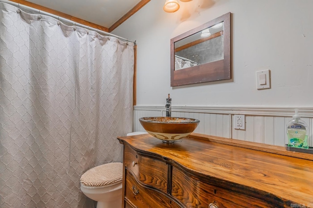 bathroom featuring ornamental molding, vanity, toilet, and a shower with curtain