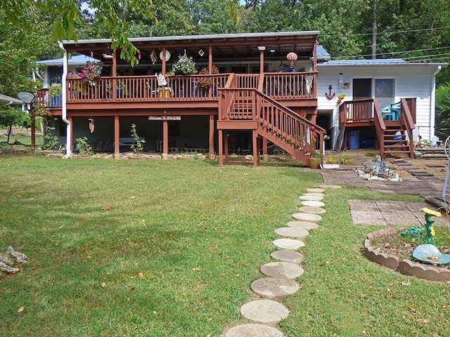 back of property with a deck and a yard