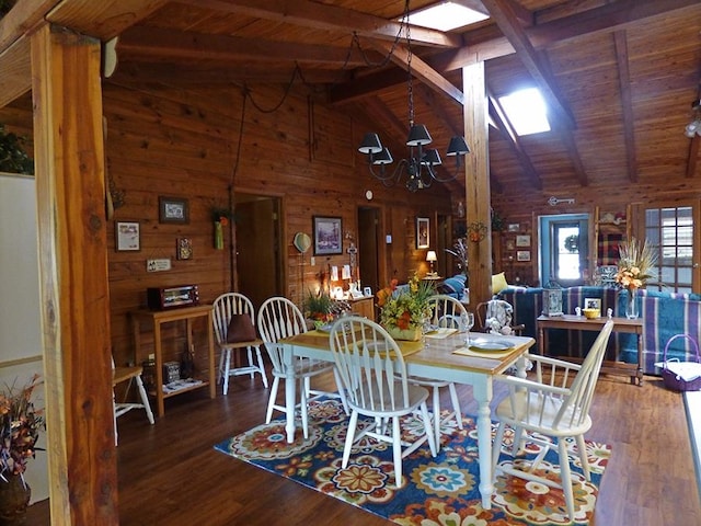 dining area with wooden ceiling, vaulted ceiling with skylight, and dark hardwood / wood-style flooring