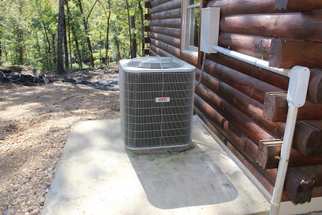 exterior details with central air condition unit and concrete flooring