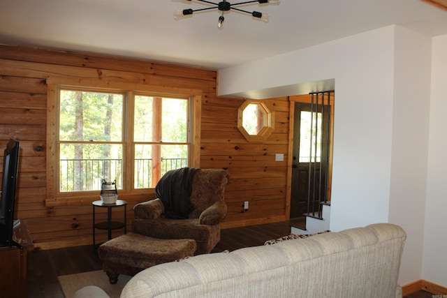 living room featuring wooden walls and hardwood / wood-style floors