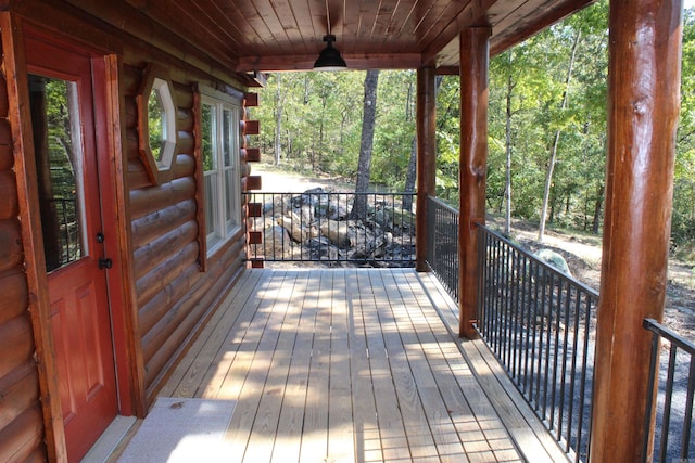 wooden terrace featuring ceiling fan