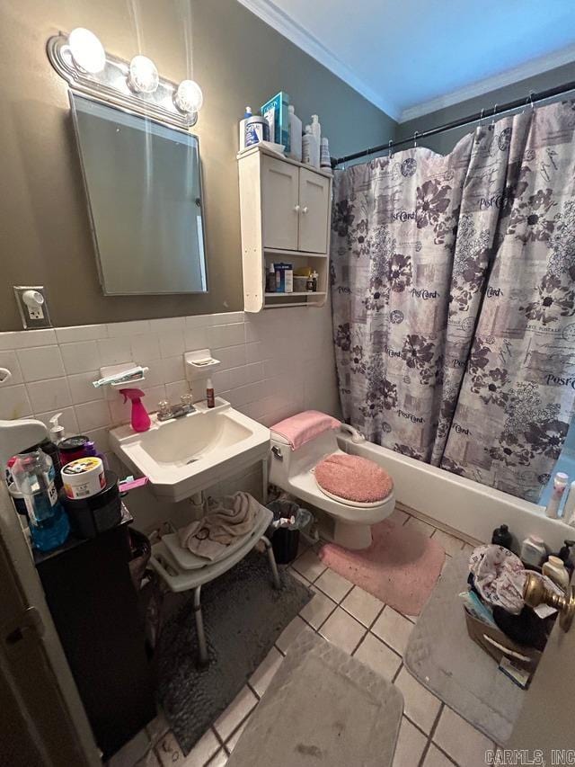 full bathroom featuring vanity, toilet, crown molding, tile patterned flooring, and shower / tub combo with curtain