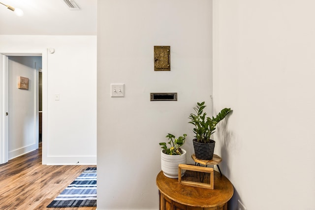 hallway with wood-type flooring