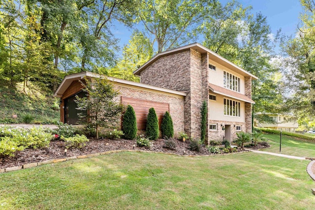 view of side of home with a yard