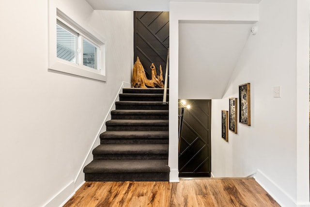 stairs with wood-type flooring