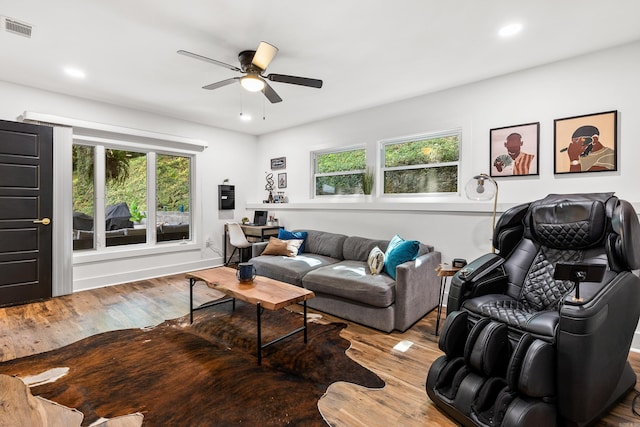 living room with ceiling fan and hardwood / wood-style floors