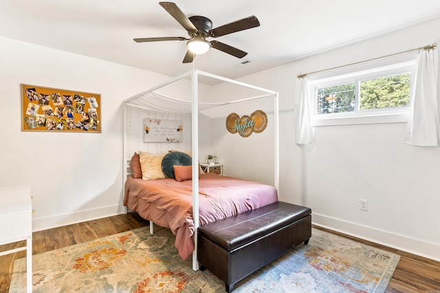 bedroom with wood-type flooring and ceiling fan