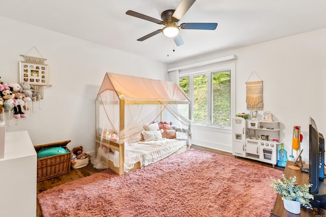 bedroom featuring ceiling fan and hardwood / wood-style flooring