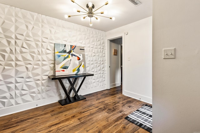 interior space with a notable chandelier and dark wood-type flooring