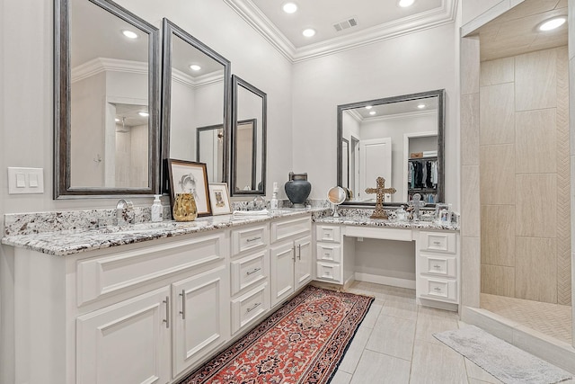 bathroom with vanity, a shower, crown molding, and tile patterned flooring