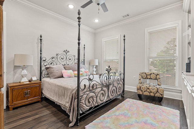 bedroom featuring ornamental molding, ceiling fan, and dark hardwood / wood-style flooring