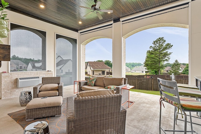 view of patio / terrace with an outdoor hangout area, ceiling fan, and a wall mounted AC