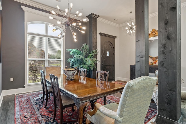 dining room with decorative columns, an inviting chandelier, dark hardwood / wood-style floors, and ornamental molding