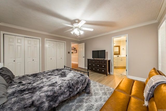 bedroom featuring light wood-type flooring, crown molding, a textured ceiling, and ceiling fan