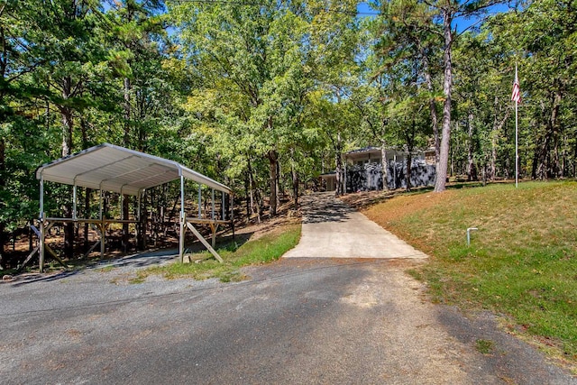 exterior space featuring a carport and a front lawn