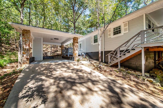 view of side of property with a carport