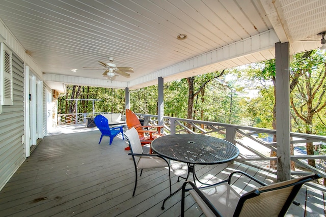 wooden terrace featuring ceiling fan