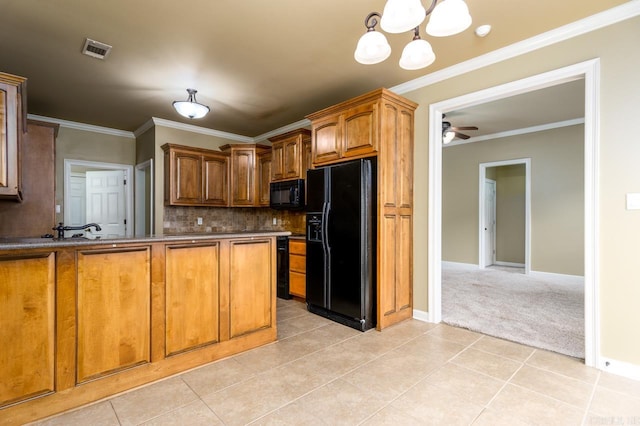 kitchen featuring ceiling fan with notable chandelier, black appliances, light tile patterned floors, and tasteful backsplash