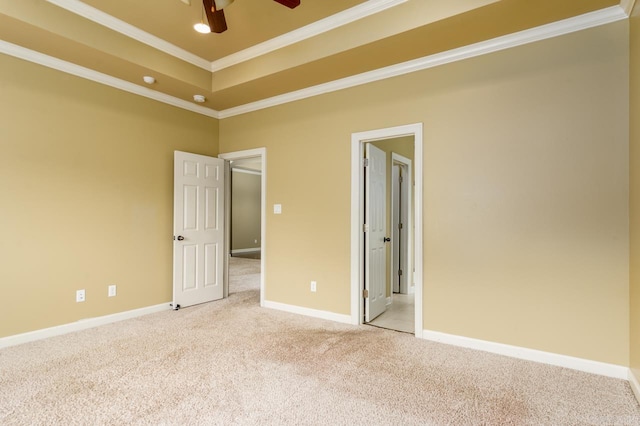 unfurnished bedroom featuring ceiling fan, crown molding, and carpet flooring