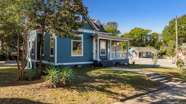 view of front of house featuring a porch and a front lawn