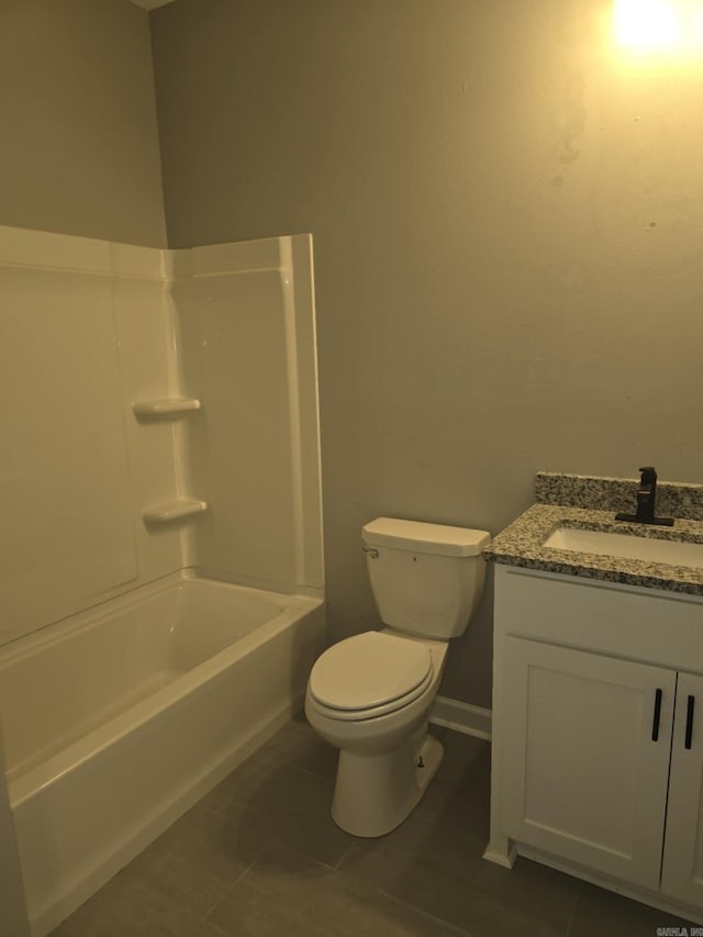 full bathroom featuring tile patterned flooring, bathtub / shower combination, vanity, and toilet