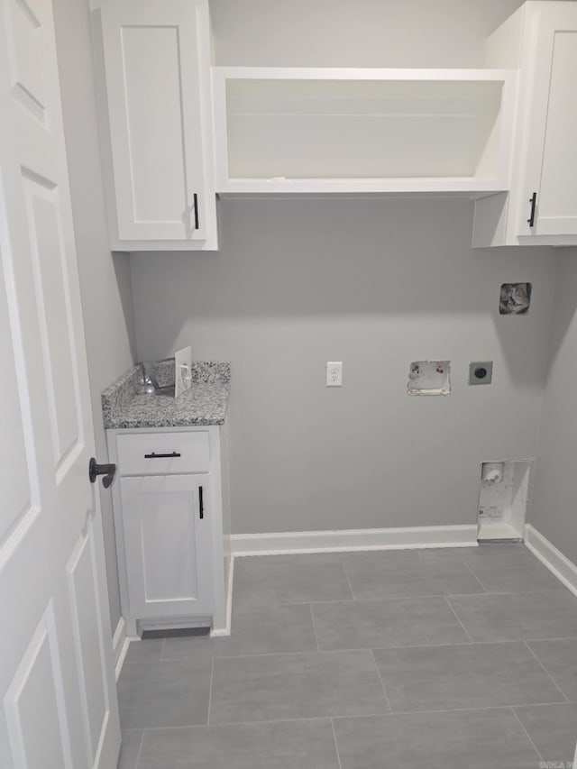 washroom with tile patterned floors, washer hookup, and hookup for an electric dryer