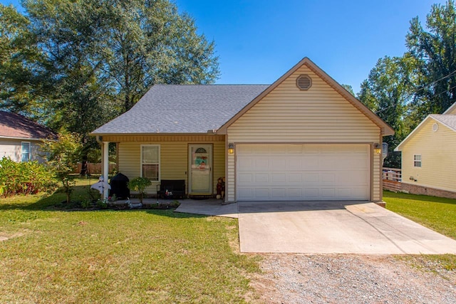 view of front facade featuring a front yard and a garage