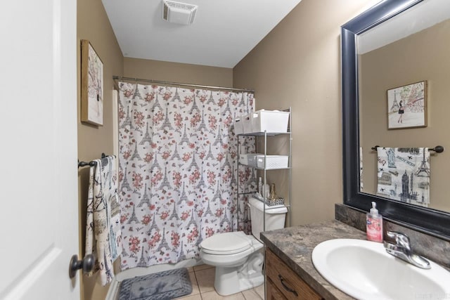 bathroom featuring tile patterned floors, walk in shower, vanity, and toilet