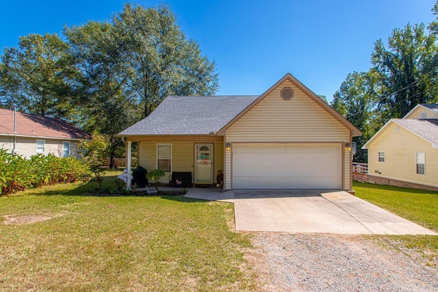 view of front of property featuring a front yard and a garage