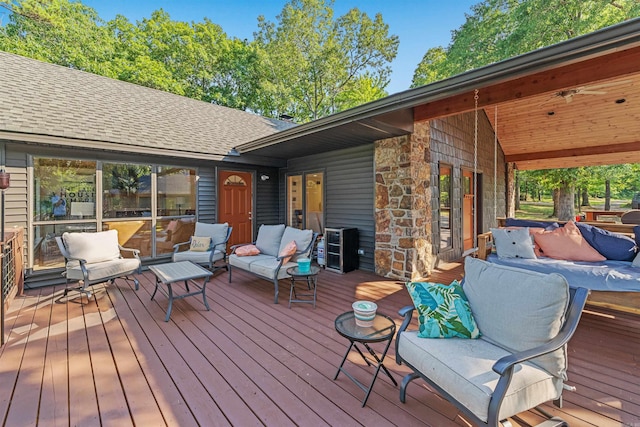 wooden terrace featuring an outdoor hangout area