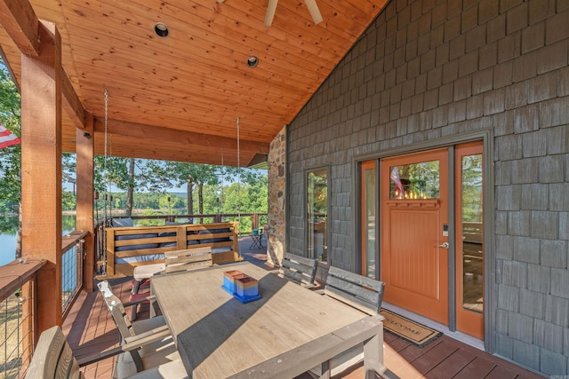 wooden deck with ceiling fan and french doors