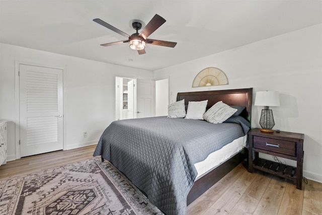 bedroom featuring light wood-type flooring and ceiling fan