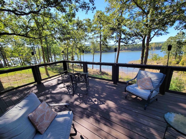 deck featuring a water view