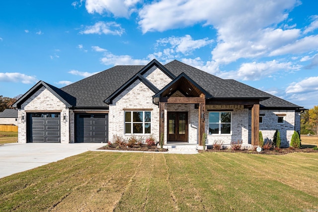 view of front facade with a front lawn and a garage