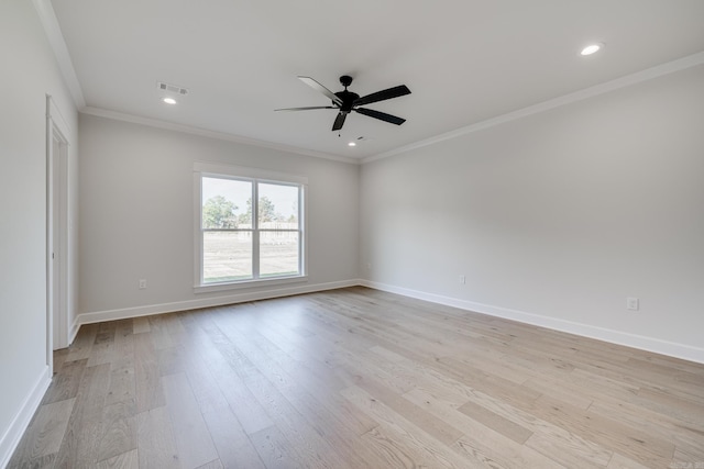 empty room featuring crown molding, light wood-type flooring, and ceiling fan