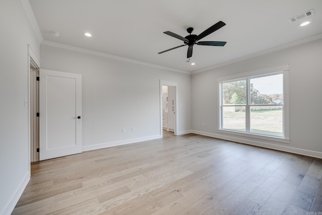 empty room with light hardwood / wood-style floors, ornamental molding, and ceiling fan