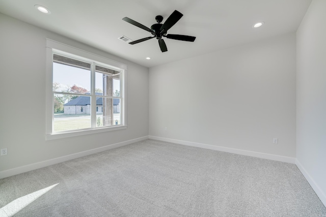 carpeted empty room with ceiling fan