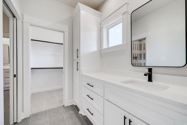 bathroom with vanity and tile patterned flooring