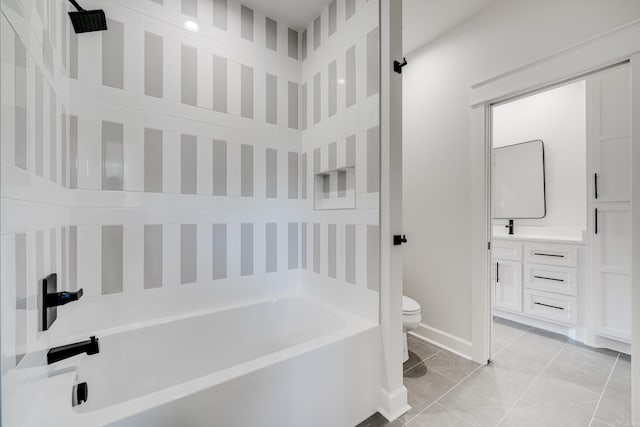 bathroom with vanity, toilet, and a tub to relax in