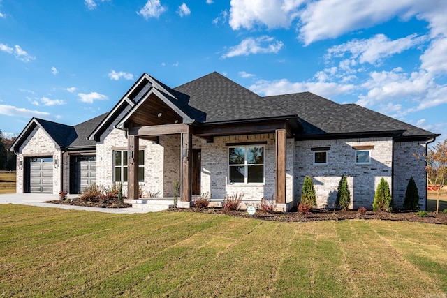 view of front facade featuring a front yard and a garage